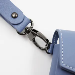 Detailed close-up view of the blue PU leather earphone case strap and metal clasp.