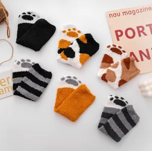 Cozy fuzzy coral fleece cat paw socks detail view, thick warm winter sleep socks for women.