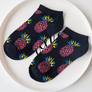 Detailed view of dark blue pineapple pattern cotton ankle boat socks placed on white plate.
