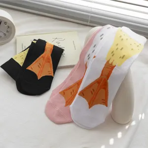 Funny novelty duck feet design pattern socks close-up, creative winter cozy hosiery detail view.