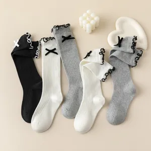 Sweet Japanese style knit ruffle bow calf socks detail, breathable cotton blend hosiery.