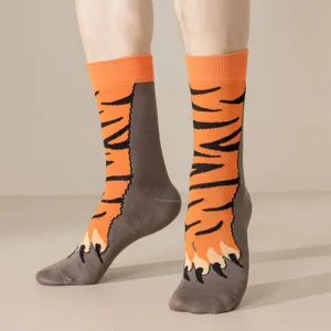 Detail view of funny tiger paw pattern print mid-calf socks for men and women autumn winter wear.