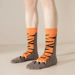 Detailed shot of funny tiger paw mid tube socks, featuring creative orange and black animal stripes.