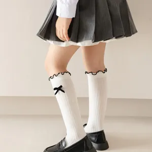 Korean style sweet white student mid-calf socks with black bow and ruffled trim for girls.