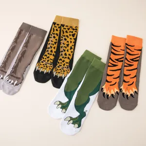 Detail shot of funny creative animal paw socks featuring wolf leopard dinosaur tiger designs.