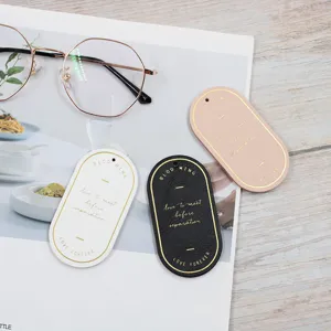 Marque-page ovale en cuir PU avec marquage à chaud, élégante étiquette décorative.