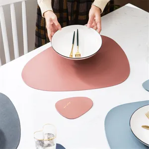 Irregular PU leather placemat set for dining table, waterproof, heat-resistant, modern home decor.