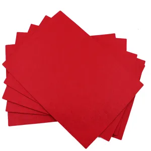 Red felt placemat detail view showing a neat stack of absorbent heat-resistant mats.