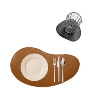 Irregular leather placemat set detail view, stylish brown heat-resistant table mat for dining room.