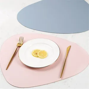 Irregular leather placemat, modern minimalist waterproof and heat-insulating table mat.
