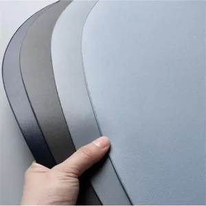 Detailed view of irregular oval table placemats set, multi-color heat-resistant mats.