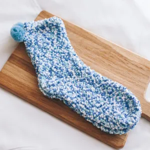 Cute fuzzy coral fleece socks detail view, soft warm winter floor sleep socks for women.