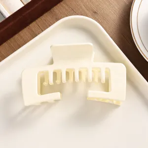 Cream matte square hair claw clip, elegant minimalist design for daily hairstyles, top view.