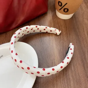 Retro red polka dot sponge headband close up detail showing width and light design