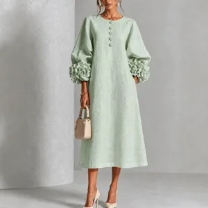 Elegant green linen midi dress with 3d floral lantern sleeves, crew neck, and chic buttons.