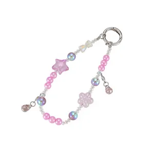 Handmade pink beaded phone charm featuring cute star and flower details for accessories.