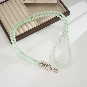 Light green spiral TPU phone lanyard crossbody strap with metal clasps and hooks for outdoor