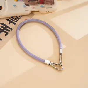 Close-up detail view of purple PU leather wrist strap with silver double metal clasps.