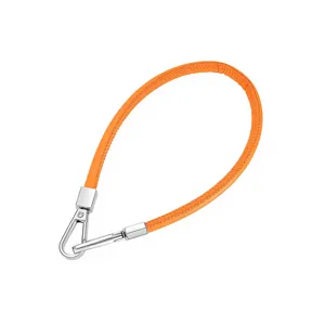 Orange PU leather wrist strap with silver metal clasps, versatile mobile phone chain accessory.