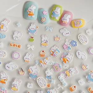 Detailed shot of 5D embossed cute cartoon rabbit nail art stickers with bows and heart patterns.