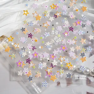 Close-up detail of 5D embossed star nail stickers featuring cute grid and colorful designs.