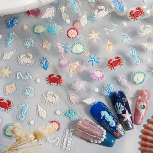 Close-up of 5D embossed ocean nail stickers with cute seashell and starfish designs.