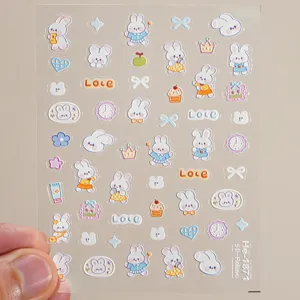 Detailed view of 5d embossed cute rabbit nail stickers with lovely bows for charming manicure art.