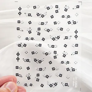 Detailed view of 5D embossed silver clover nail art stickers, perfect for creative manicure designs.