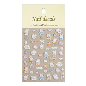 Detailed view of 5D embossed cute rabbit nail art stickers with bows and heart patterns for DIY.