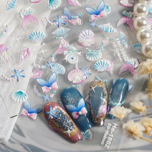 5D embossed ocean theme nail art stickers with butterfly and shell designs for DIY manicure.