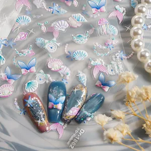 Detailed close-up of 5D embossed ocean nail stickers featuring cute shells, jellyfish and pearls.