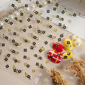 5D embossed gold small flower nail stickers, trendy 3D adhesive nail art decals for women.