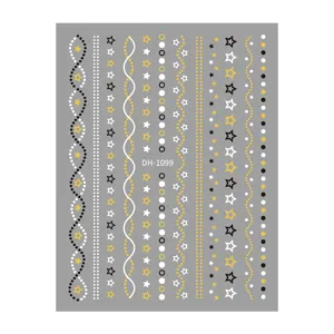 Nail art sticker detail sheet showing gold foil stripes and five-pointed stars pattern.