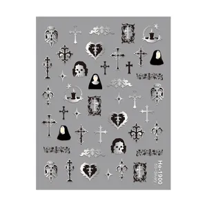 Detailed view of 5D embossed silver gothic nail stickers featuring crosses and skull designs.