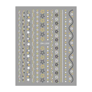 Detail view of 3D gold foil star and stripe nail art sticker sheet with delicate patterns.