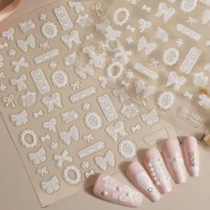 5D embossed lace bow nail art stickers Dr-1891, featuring delicate white relief designs for manicures.