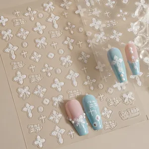 5D embossed nail art stickers featuring elegant lace, bows, and cross designs for DIY manicures.