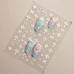 5D embossed nail stickers featuring lace bows and cross designs for trendy manicures.