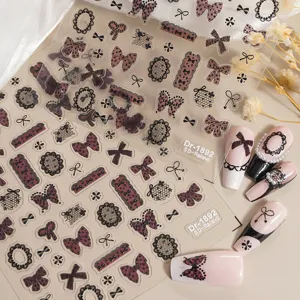 Detailed view of 5D embossed lace bow nail stickers for stunning creative manicure art.