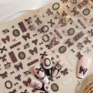 Detailed view of 5D embossed lace bow nail art stickers sheet with gorgeous finished nail tips.