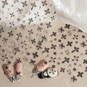 5D relief nail art sticker, Gothic cross and bow design for trendy manicure details.