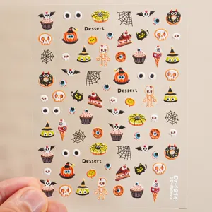 Autocollants d'ongles Halloween 5D gaufrés avec des motifs de fantômes et squelettes.