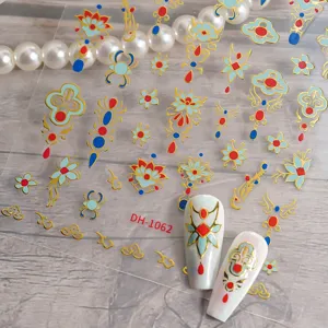 3D gold foil nail art stickers with traditional vintage red blue patterns for DIY manicure decor.