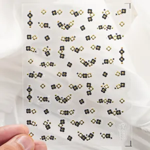 5D embossed black and gold clover nail art stickers, elegant manicure decoration.