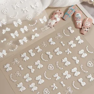 5D ingeleste strik parel nagelstickers, fijn wit reliëf design voor nail art manicure decoratie.