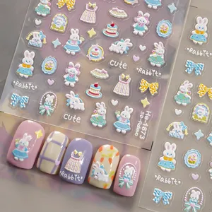 Detailed close-up of 5D embossed cute rabbit and bow nail art stickers with sweet cartoon designs.