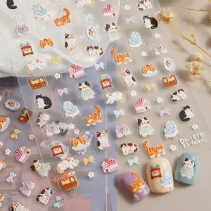 Close-up of 5D embossed cute cat nail stickers sheet, showcasing delicate 3D feline designs.