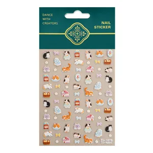 Detailed view of 5D embossed cute cat nail stickers featuring mini bows, houses, and clocks.