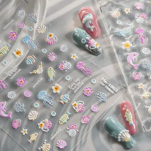 5D relief ocean nail stickers featuring cute dolphins, jellyfish, seashells and fish designs.