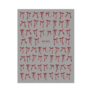 Detailed view of red bow nail art stickers sheet, adhesive decals with model DH-1071.